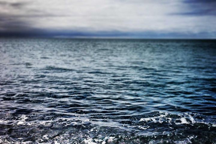 A dark sea under heavy clouds